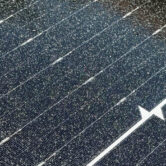 Paint overspray on solar panels requiring professional removal