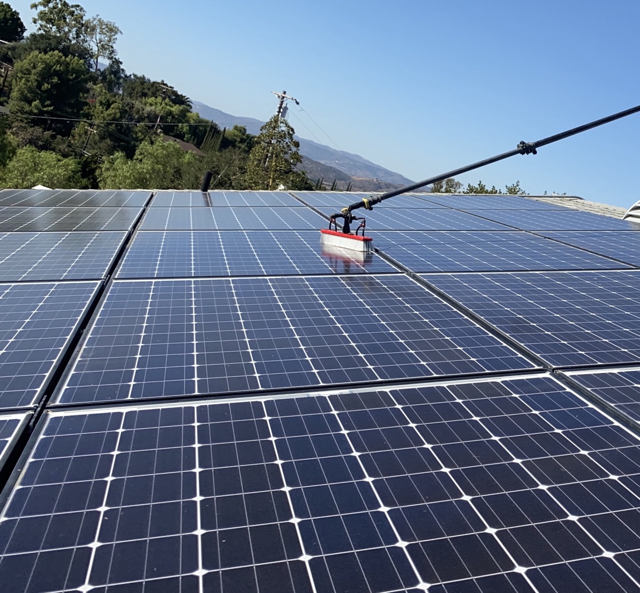 Professional solar panel cleaning robot used on large-scale ground-mounted or carport solar arrays