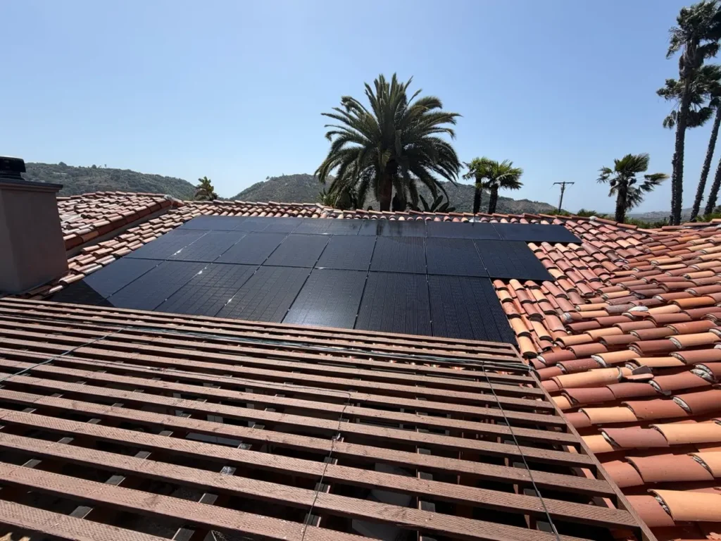 Residential rooftop solar panels on a clay tile roof in Escondido California before professional solar panel cleaning