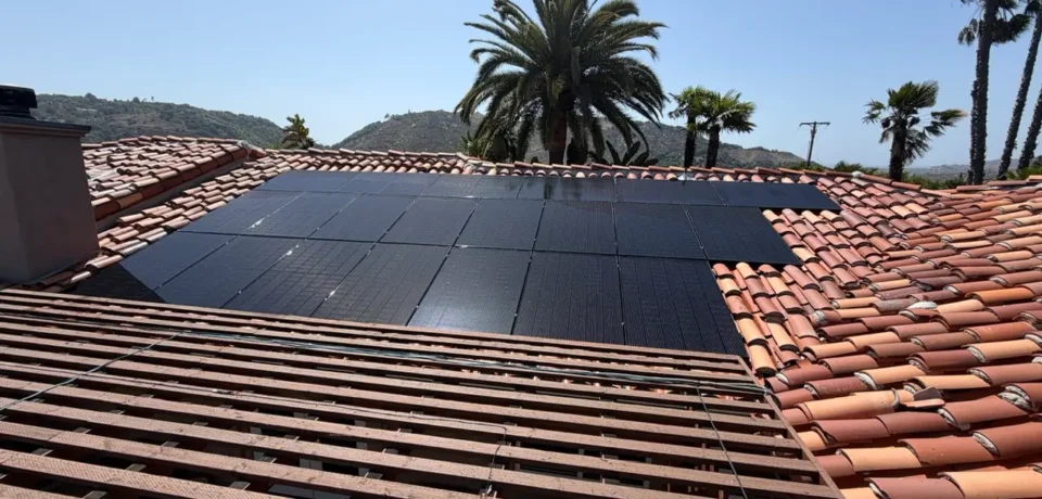 Residential rooftop solar panels on a clay tile roof in Escondido California before professional solar panel cleaning