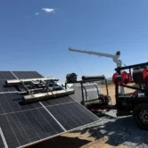 professional-solar-panel-cleaning-equipment Professional solar panel cleaning equipment using a rotating brush system on ground-mounted solar panels