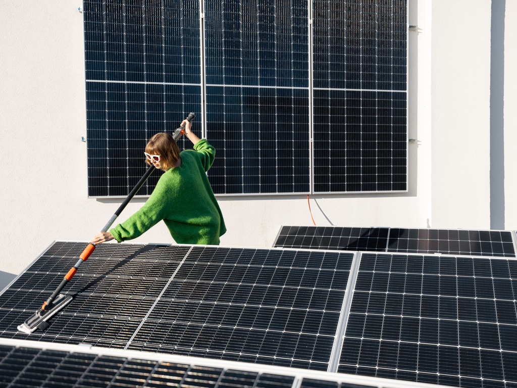 Professional solar panel cleaning in San Diego using a rotating brush and telescoping pole